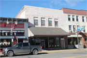 115 S KNOWLES AVE, a Twentieth Century Commercial retail building, built in New Richmond, Wisconsin in 1918.