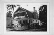 916 E WASHINGTON ST, a Dutch Colonial Revival house, built in Wausau, Wisconsin in 1912.