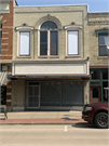 144 E MAIN ST, a Commercial Vernacular retail building, built in Stoughton, Wisconsin in .