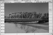 STATE HIGHWAY 54 AND THE WOLF RIVER, a overhead truss bridge, built in Shiocton, Wisconsin in 1938.