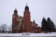 109 E PULASKI ST, a Romanesque Revival church, built in Pulaski, Wisconsin in 1923.