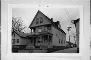 823-25 S 11TH ST, a Queen Anne duplex, built in Milwaukee, Wisconsin in 1905.