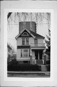 1832-1834 N WARREN AVE, a Queen Anne duplex, built in Milwaukee, Wisconsin in 1902.