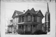 31 N WISCONSIN ST, a Queen Anne house, built in Janesville, Wisconsin in 1909.