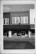142 S MAIN ST, a Commercial Vernacular grocery, built in Shawano, Wisconsin in 1916.