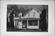 407 N 1ST ST, a Gabled Ell house, built in New Richmond, Wisconsin in 1949.