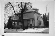 68 E WALWORTH AVE, a American Foursquare house, built in Delavan, Wisconsin in 1903.