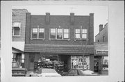 113 - 115 S Main St, a Commercial Vernacular retail building, built in West Bend, Wisconsin in 1924.