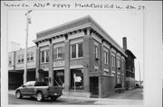 108 W 4TH ST, a Neoclassical/Beaux Arts small office building, built in Marshfield, Wisconsin in 1903.