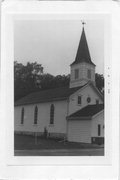 W SIDE OF SPRING VALLEY RD, 1.1 M N OF TABLE BLUFF RD, a Early Gothic Revival church, built in Berry, Wisconsin in 1891.