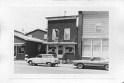 NEXT TO 123 MAIN ST, a Commercial Vernacular tavern/bar, built in Belleville, Wisconsin in .