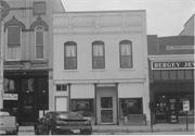 115 S MAIN ST, a Commercial Vernacular retail building, built in Oregon, Wisconsin in 1877.