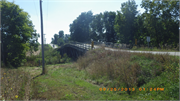Five Corner Road over WSOR railroad tracks, .25 miles south of the intersection of Five Corner Road and CTH K, a wood bridge, built in Jefferson, Wisconsin in 1960.