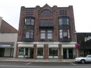 317 W 2ND ST, a Romanesque Revival retail building, built in Ashland, Wisconsin in 1892.