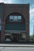 311 MAIN ST E, a Romanesque Revival retail building, built in Ashland, Wisconsin in 1890.