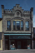 411 W 2ND ST, a Romanesque Revival retail building, built in Ashland, Wisconsin in 1911.