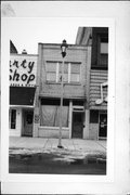 417 W 2ND ST (AKA 417 MAIN ST W), a Commercial Vernacular retail building, built in Ashland, Wisconsin in 1935.