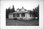 SW SHORE, SAND ISLAND, APOSTLE ISLANDS, a One Story Cube house, built in Bayfield, Wisconsin in 1909.