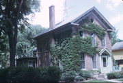 225 SHEBOYGAN ST, a Greek Revival house, built in Fond du Lac, Wisconsin in 1875.