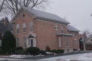 225 SHEBOYGAN ST, a Greek Revival house, built in Fond du Lac, Wisconsin in 1875.
