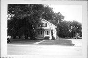 565 W SCOTT ST, a Dutch Colonial Revival house, built in Fond du Lac, Wisconsin in 1900.