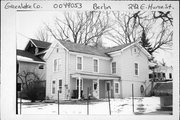 242 E HURON ST, a Gabled Ell house, built in Berlin, Wisconsin in 1900.