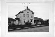 201 E WALNUT ST, a Greek Revival house, built in Dodgeville, Wisconsin in 1846.