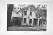 W3167 GREEN ISLE DRIVE, a Greek Revival house, built in Hebron, Wisconsin in 1849.