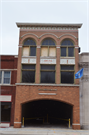 CA 115 N MAIN ST, a Romanesque Revival retail building, built in Lake Mills, Wisconsin in 1895.