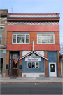 129 N MAIN ST, a Commercial Vernacular retail building, built in Lake Mills, Wisconsin in 1897.