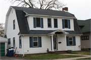 717 PLUMER ST, a Dutch Colonial Revival house, built in Wausau, Wisconsin in 1932.