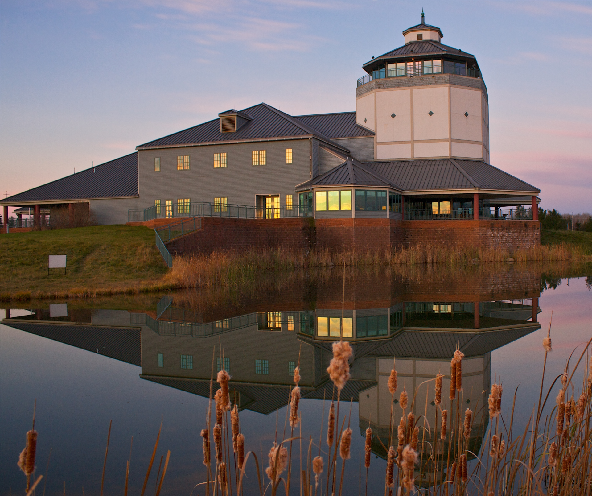 Great lakes Visitor Center viewed from the water at sunset
