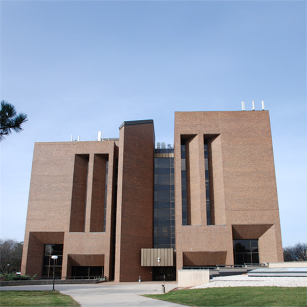Cofrin Library, a large brick building in a brutalist style