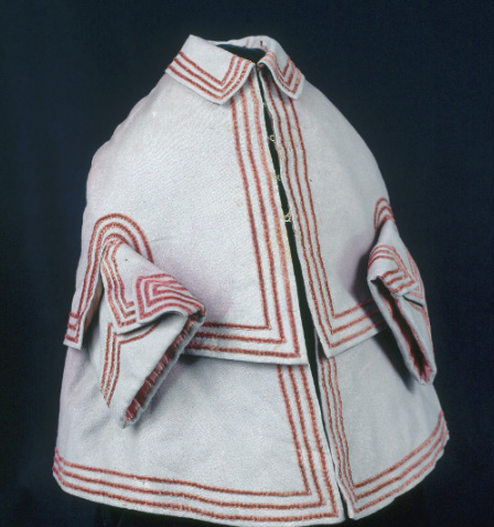 Three-quarter view of girl's faded gray coat with red velvet trim. Worn by Jane Larned (Williamson) Hague (born 1819) in Pittsburgh, Pennsylvania.