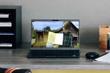 A laptop screen with a educator sharing a virtual program
