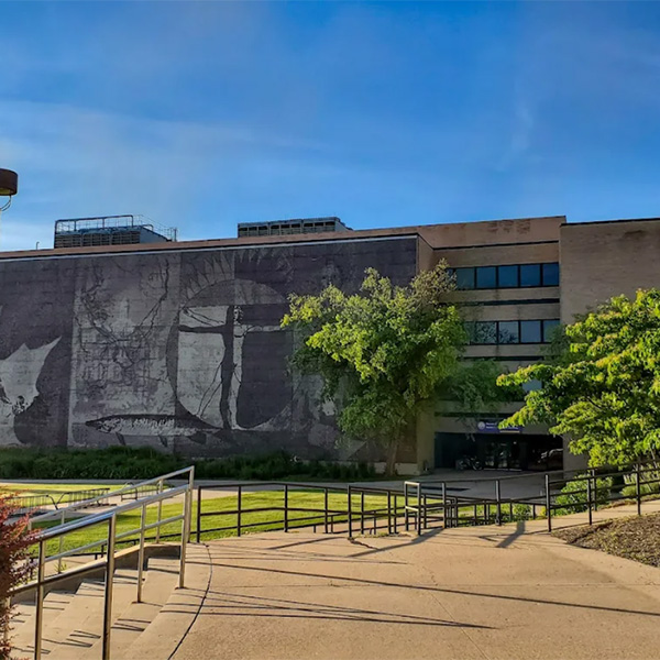 The Trainer Natural Resources building. A mural is drawn on its outer wall.