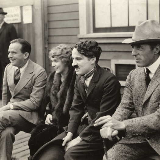 Four of the founders of United Artists, Douglas Fairbanks, Mary Pickford, Charlie Chaplin, and D.W. Griffith.