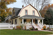 803 DERBY LN, a Dutch Colonial Revival house, built in Allouez, Wisconsin in 1910.