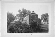 N SIDE OF W, 1 MILE W OF NEW DIGGINGS, a Greek Revival house, built in New Diggings, Wisconsin in 1855.