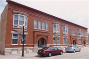 132-140 HIGH ST & 9 BROWN ST, a Romanesque Revival row house, built in Oshkosh, Wisconsin in 1897.