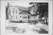 NOBLE ST, AT INTERSECTION WITH COLE ST, E SIDE, a Gabled Ell house, built in Gratiot, Wisconsin in 1900.