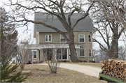 3314 STATE HIGHWAY 83, a Dutch Colonial Revival house, built in Wheatland, Wisconsin in 1915.