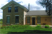 76 US Highway 14, a Gabled Ell house, built in Rutland, Wisconsin in 1850.