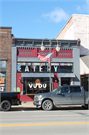 121 S KNOWLES AVE, a Commercial Vernacular small retail building, built in New Richmond, Wisconsin in 1906.