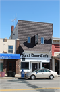 206 S KNOWLES AVE, a Commercial Vernacular small retail building, built in New Richmond, Wisconsin in 1900.