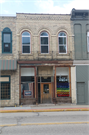 11 E MAIN ST, a Romanesque Revival retail building, built in Watertown, Wisconsin in 1870.
