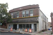 7505 & 7513 HARWOOD AVE, a Twentieth Century Commercial large retail building, built in Wauwatosa, Wisconsin in 1909.