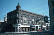 921 S 8TH ST, a Queen Anne retail building, built in Manitowoc, Wisconsin in 1899.