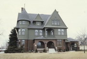 610 N 8TH ST, a Shingle Style house, built in Manitowoc, Wisconsin in 1891.