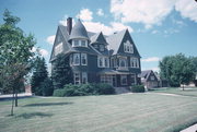 610 N 8TH ST, a Shingle Style house, built in Manitowoc, Wisconsin in 1891.